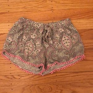 Cute flowey patterned shorts with pink fringe